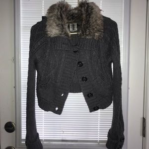 Sweater with faux fur collar.